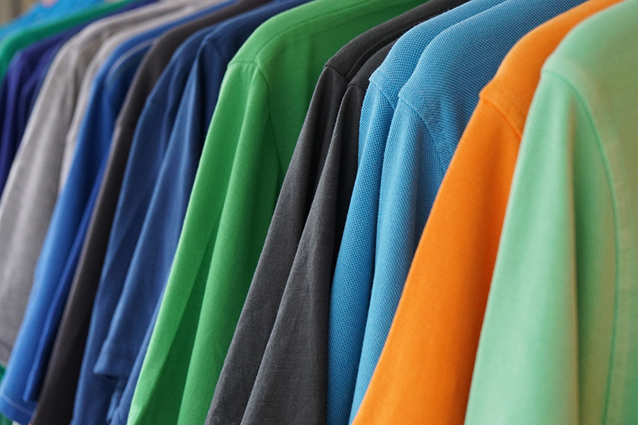 rack of polos in assorted colors