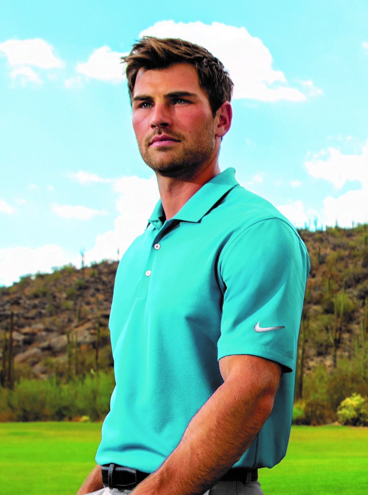 SanMar-BusCasual-PIC-3-Man-wearing-turquoise-Nike-polo-shirt